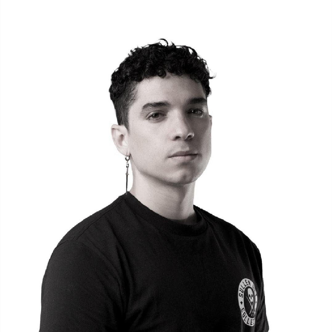 Tattoo artist in black Sullen Collective shirt, FYT Tattoo Supplies New York studio style