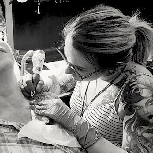 Tattoo artist using FYT tattoo supplies and cartridges on client in New York studio