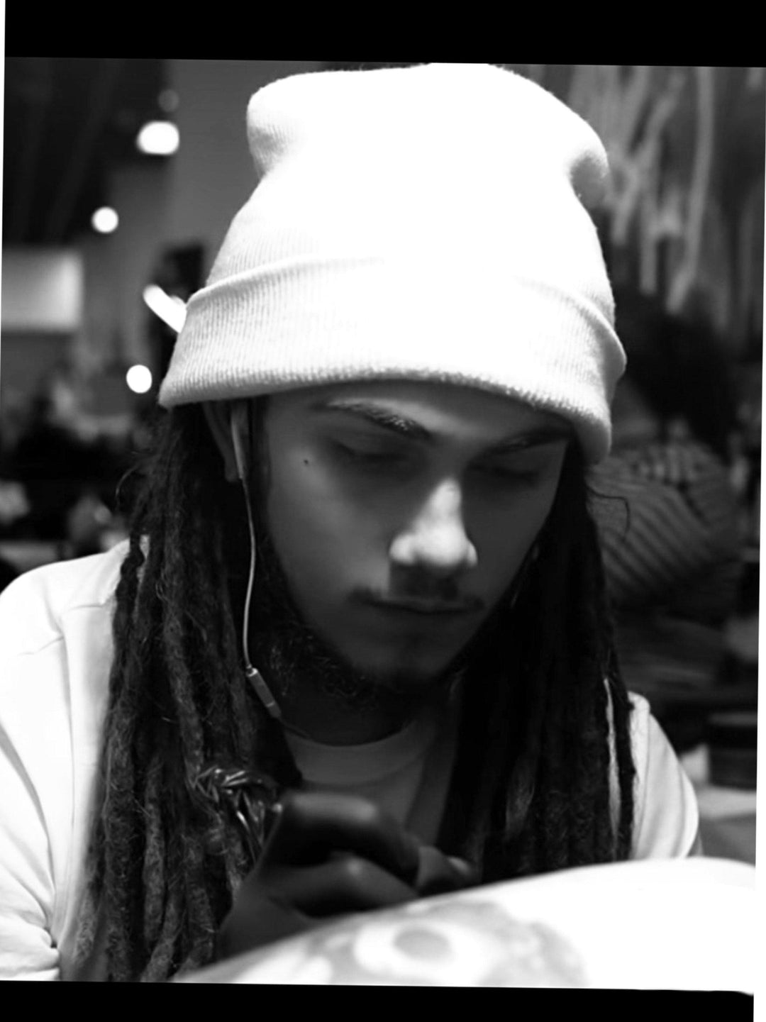 Tattoo artist in white beanie using FYT tattoo supplies in a New York studio.